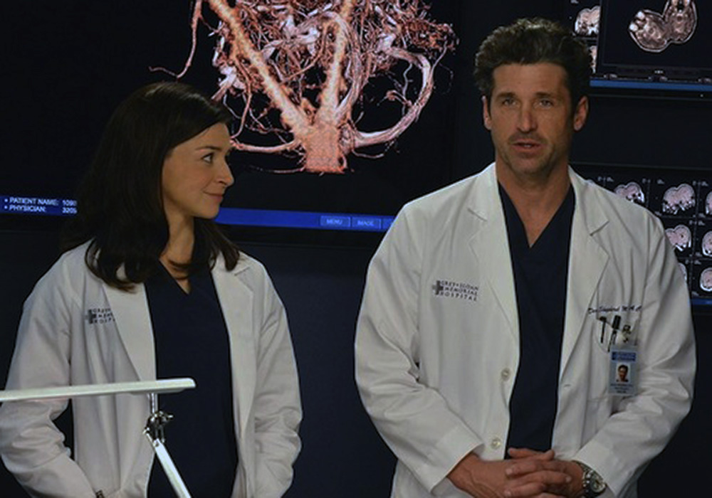 Still of Amelia (played by Caterina Scorsone) and Derek (played by Patrick Dempsey) from Grey's Anatomy 10x22