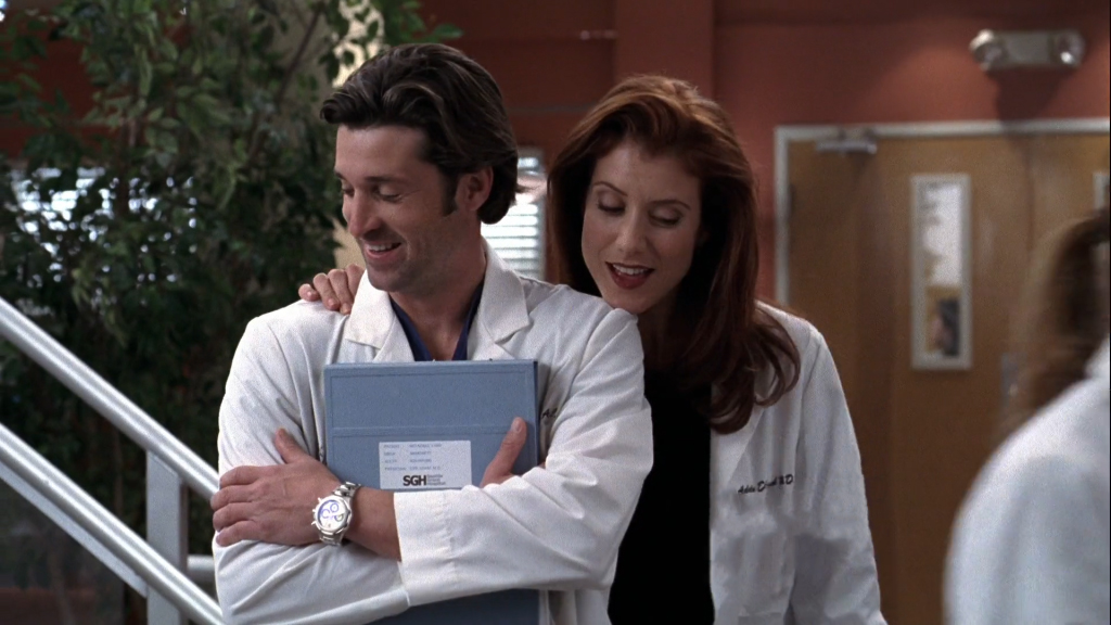 Still Addison (played by Kate Walsh) with her arm around Derek (played by Patrick Dempsey) from Grey's Anatomy 2x15